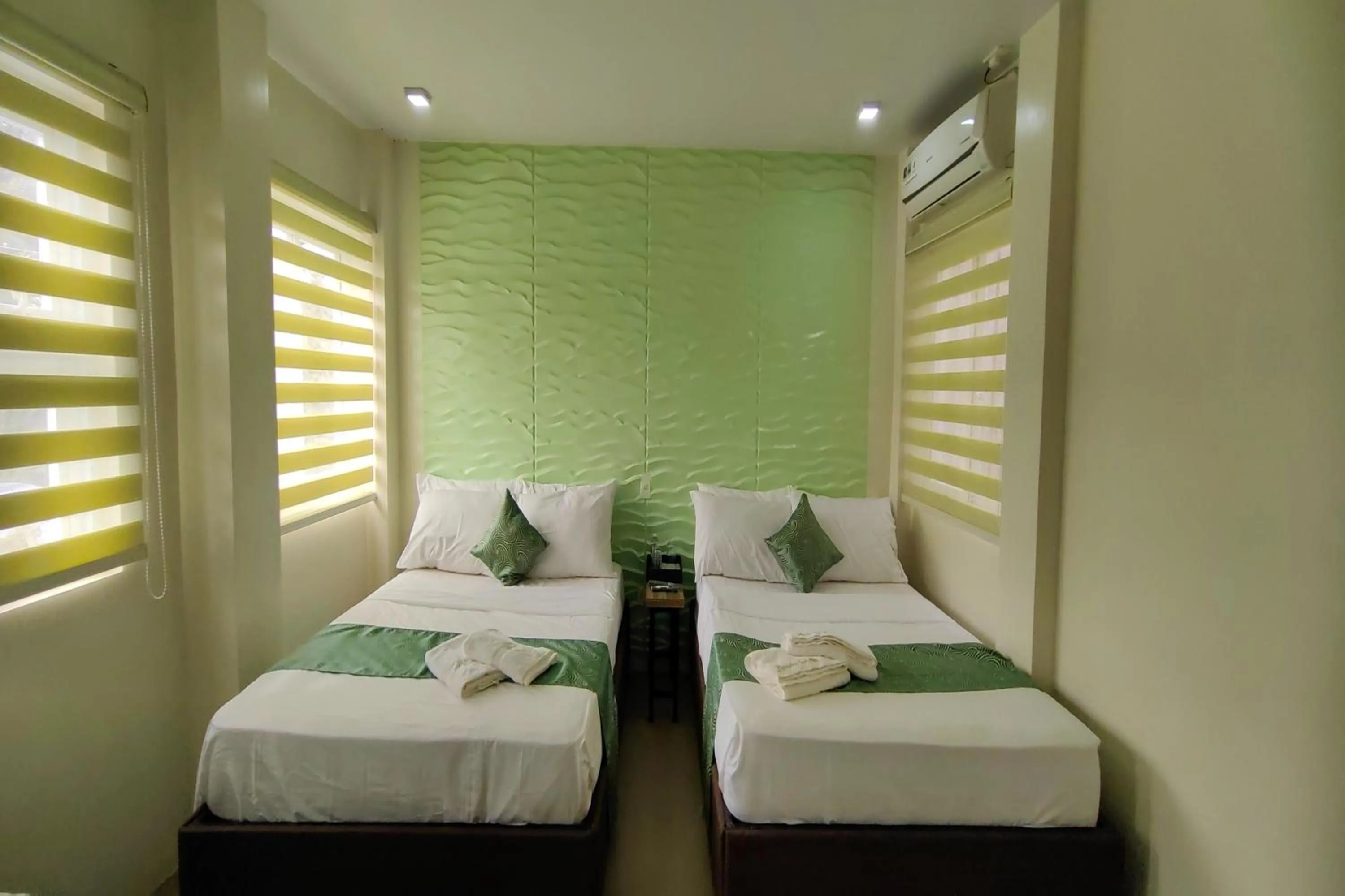 Bed in Manuela Suites Puerto Princesa near Airport