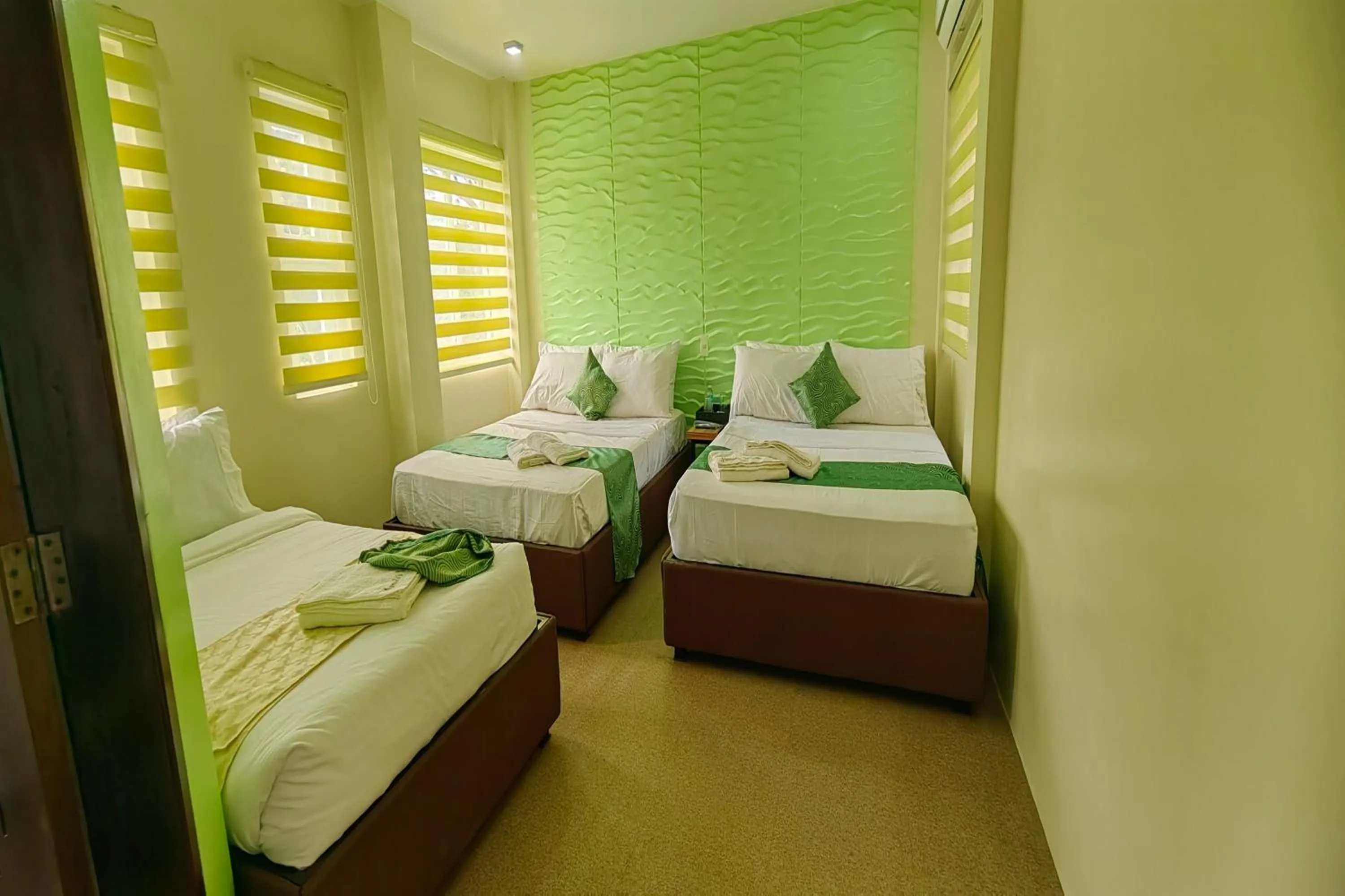Bed in Manuela Suites Puerto Princesa near Airport