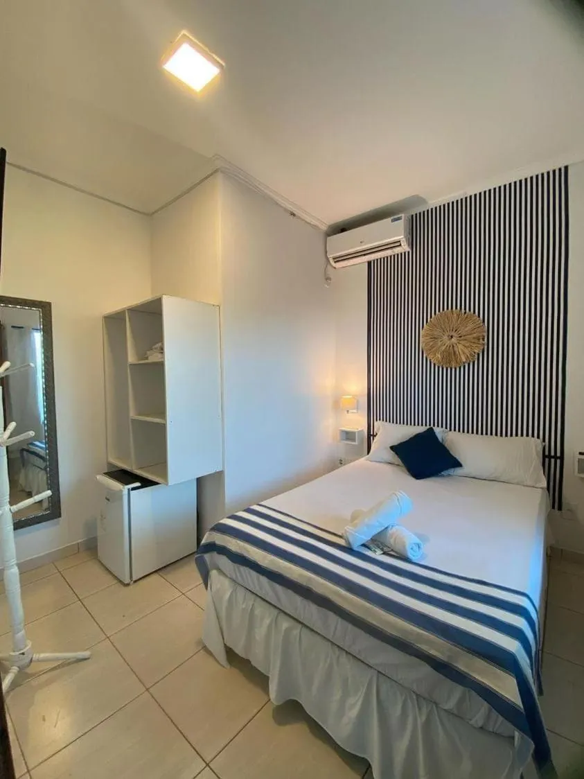 Photo of the whole room, Bed in Terra Nova Cabo Frio Front Beach