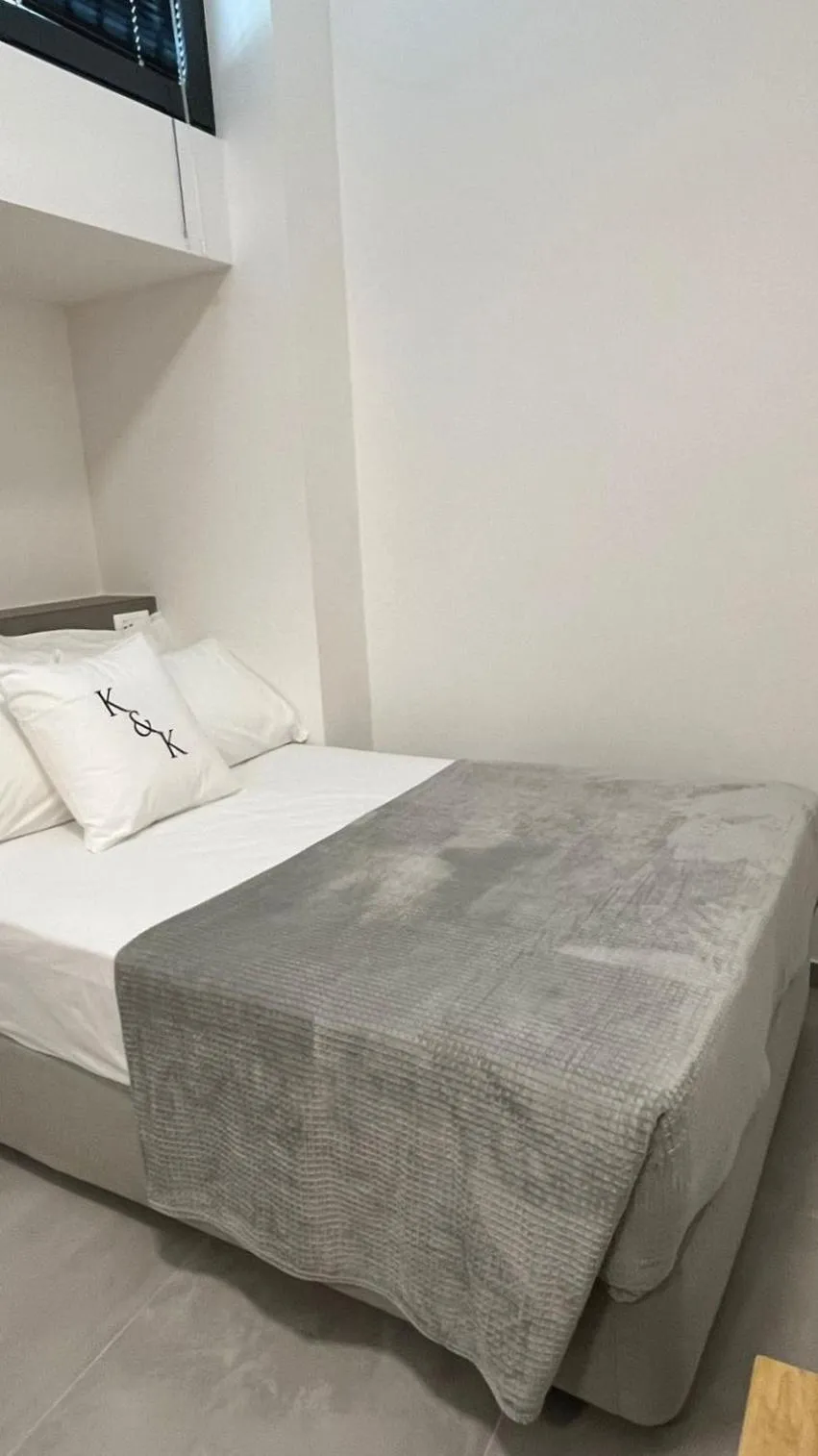 Bed in AIONION RESIDENCES by K&K