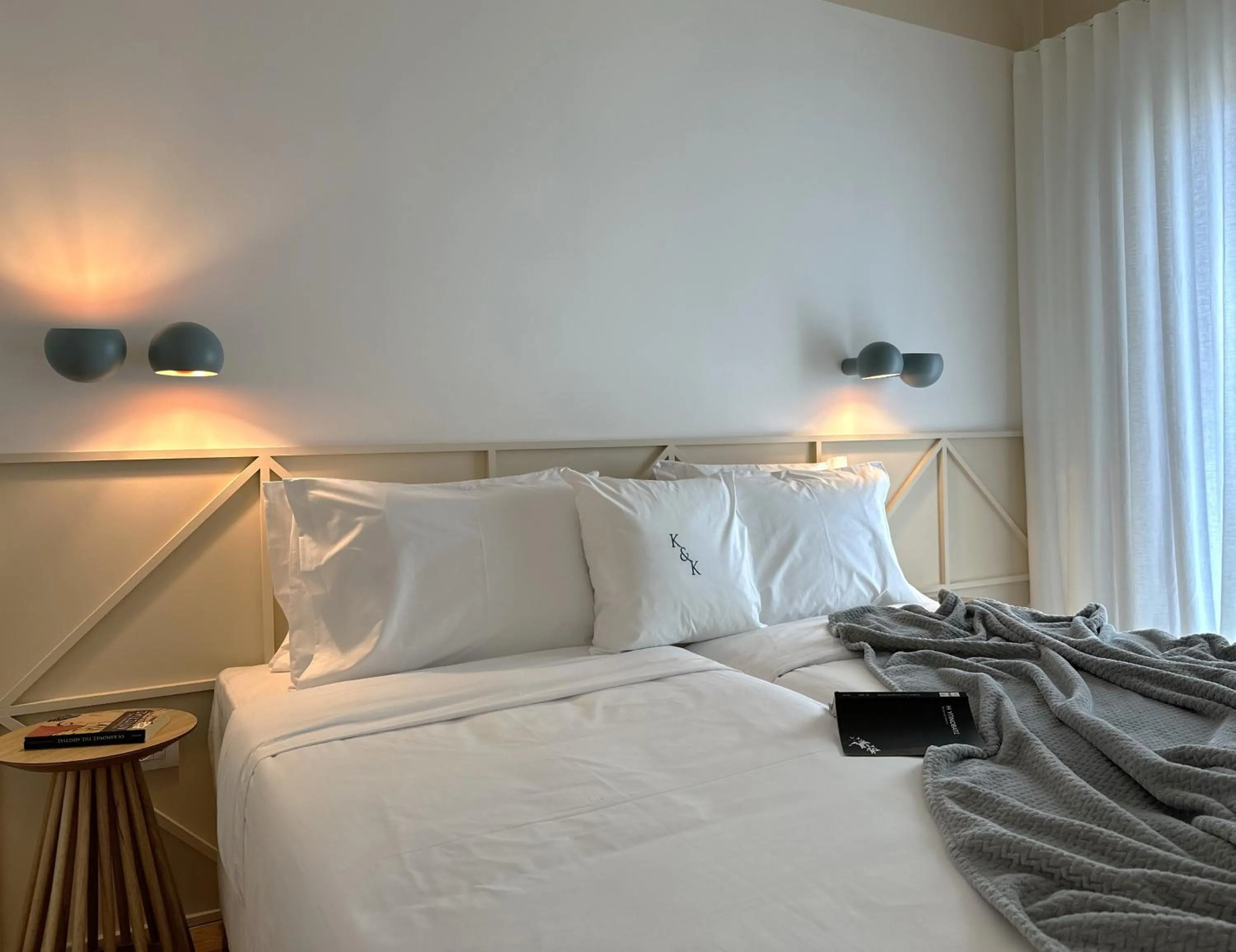 Bed in AIONION RESIDENCES by K&K