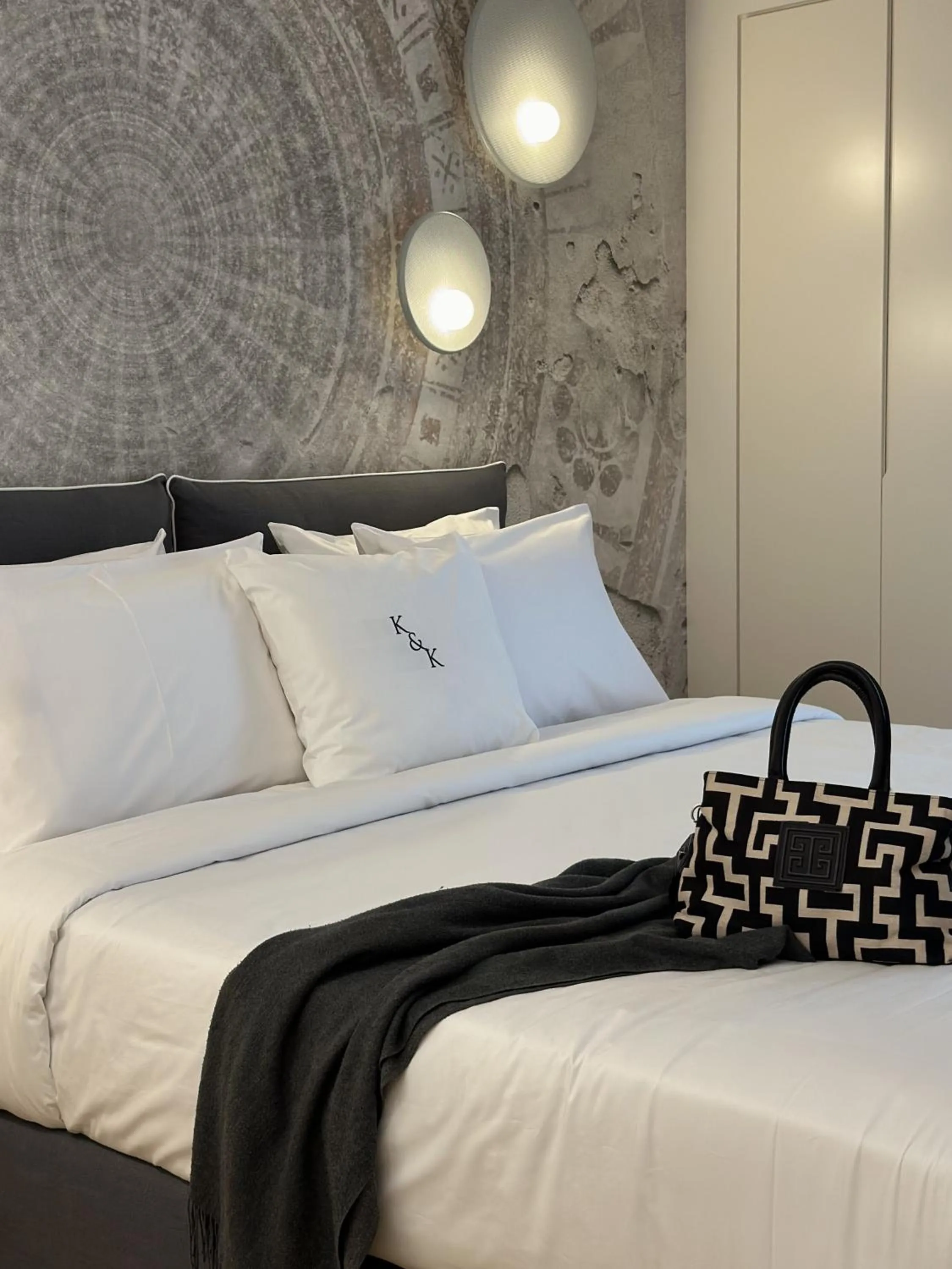 Bed in AIONION RESIDENCES by K&K