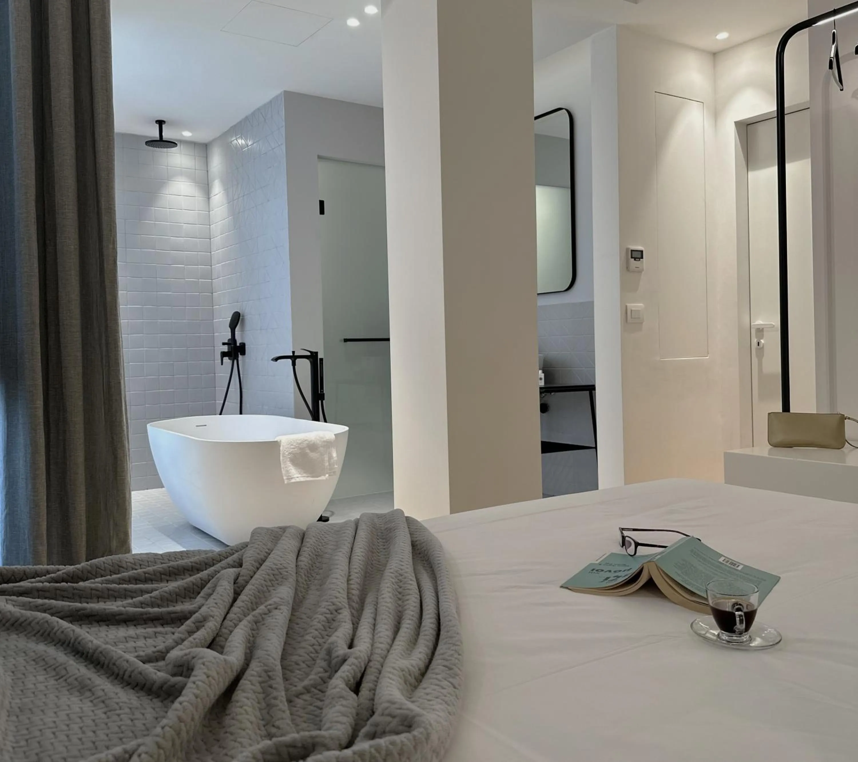 Bed in AIONION RESIDENCES by K&K