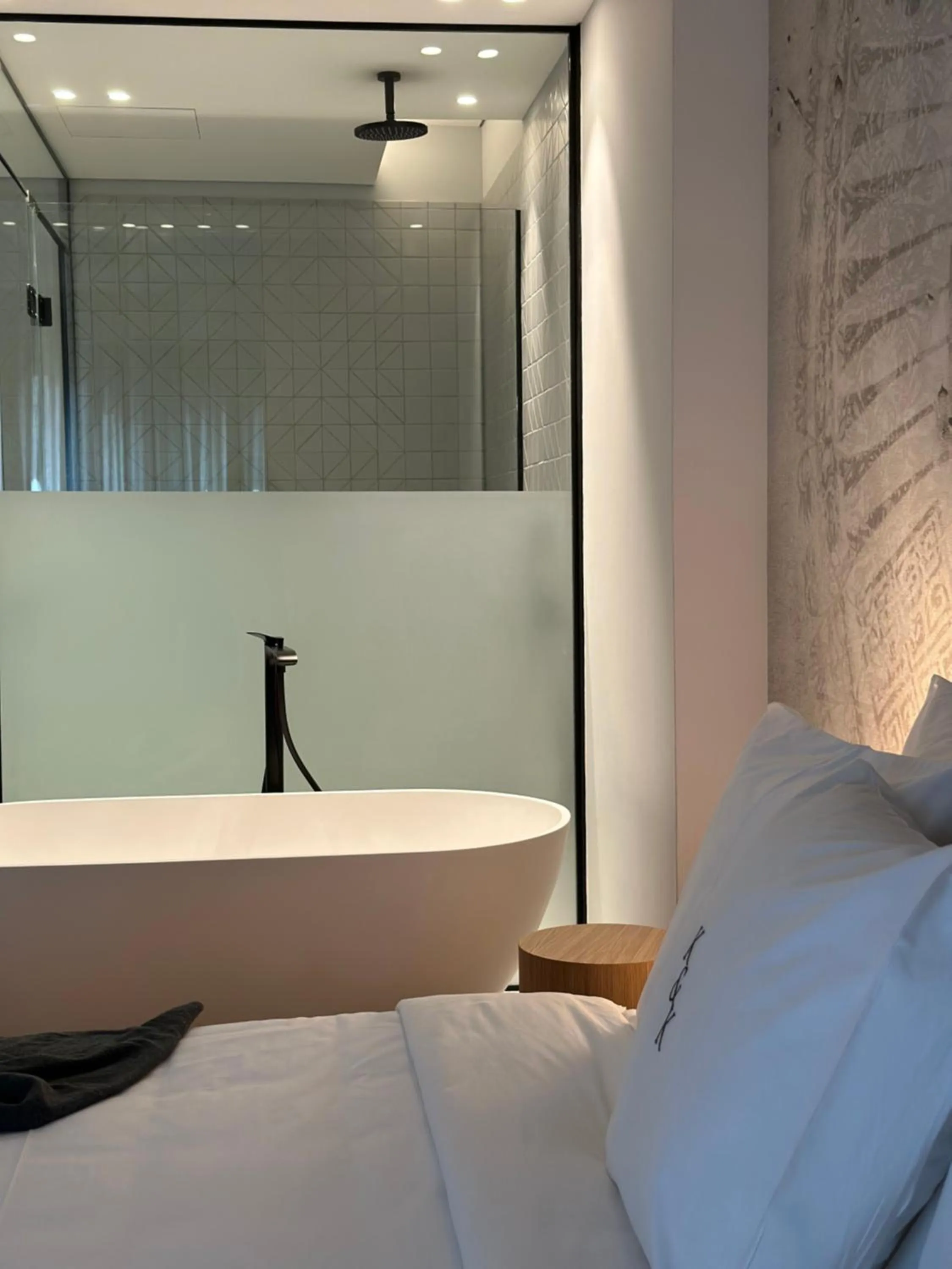 Bed in AIONION RESIDENCES by K&K