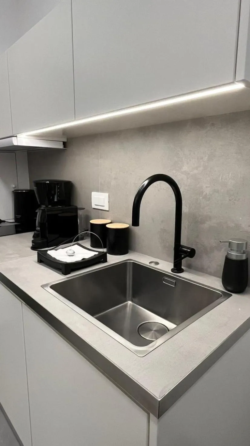 Kitchen or kitchenette in AIONION RESIDENCES by K&K