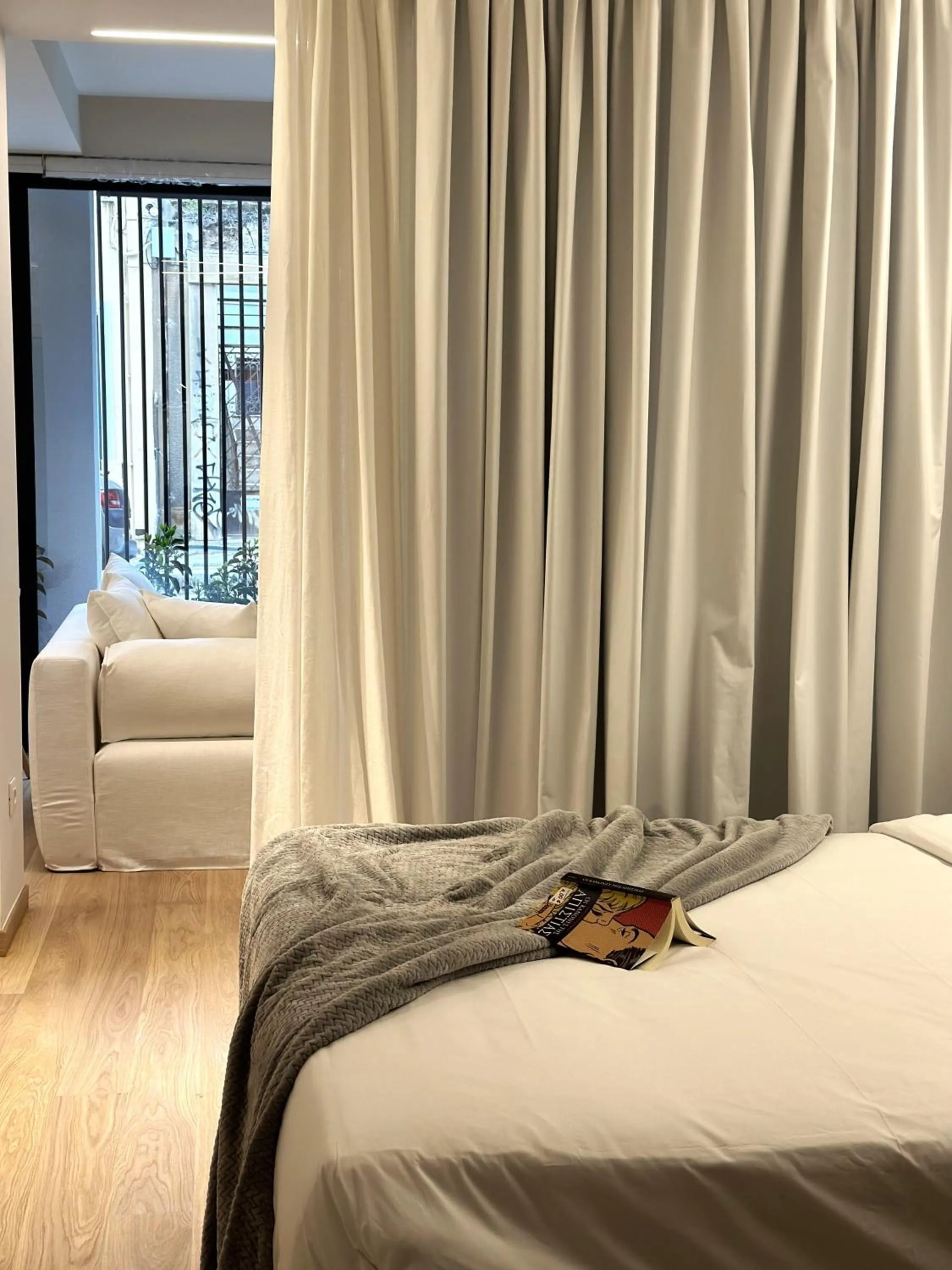 Bed in AIONION RESIDENCES by K&K