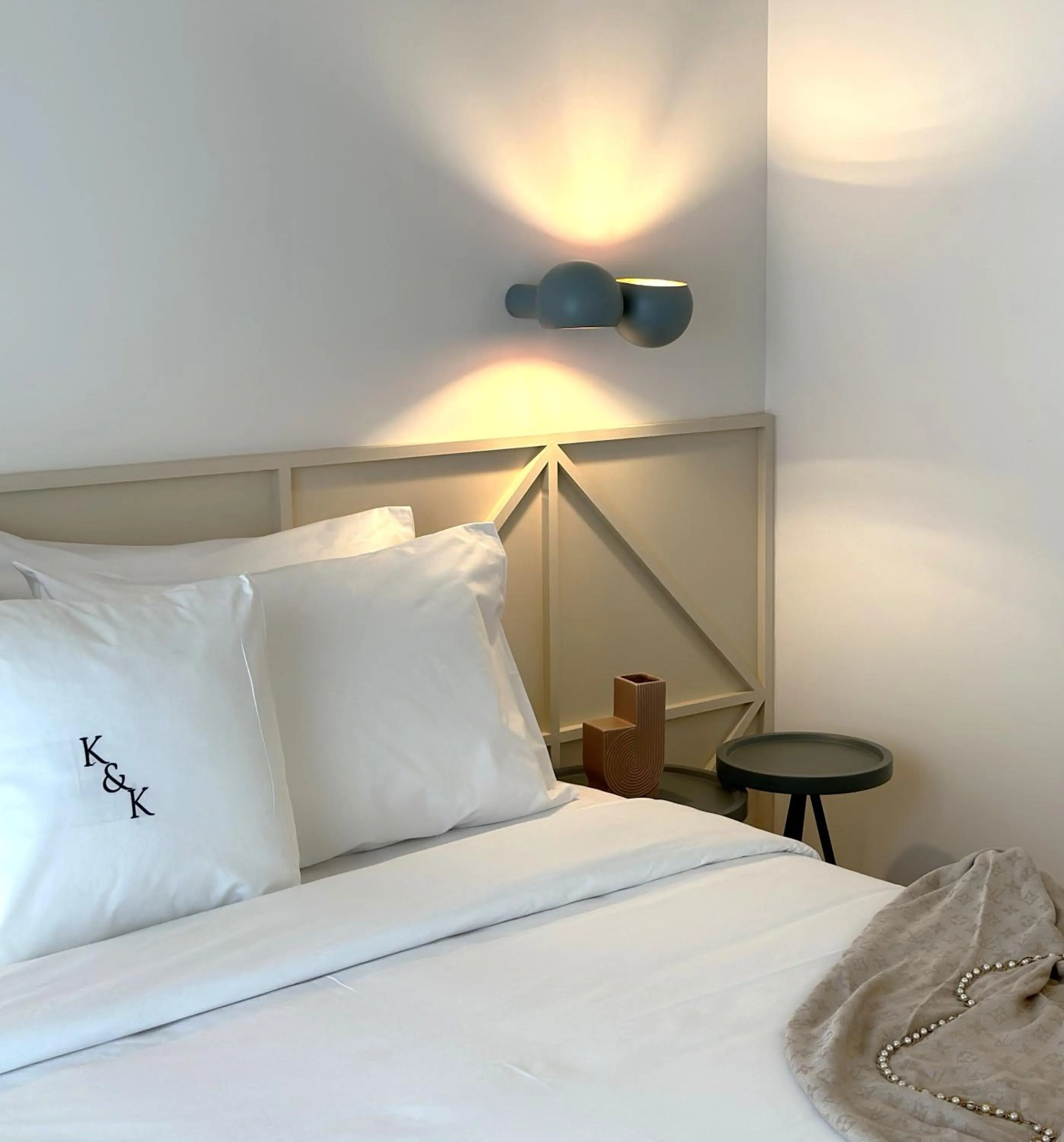 Bed in AIONION RESIDENCES by K&K