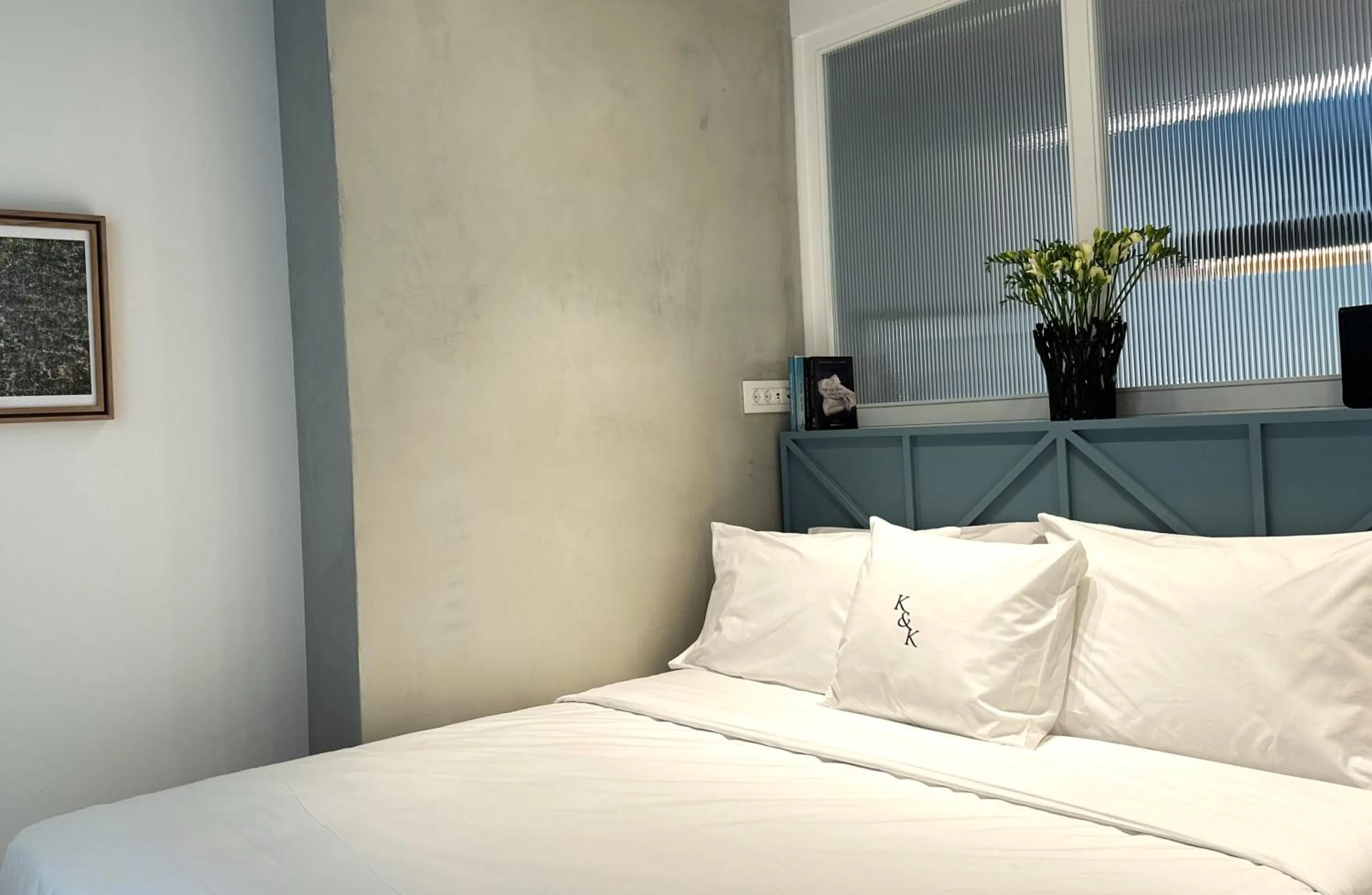 Bed in AIONION RESIDENCES by K&K