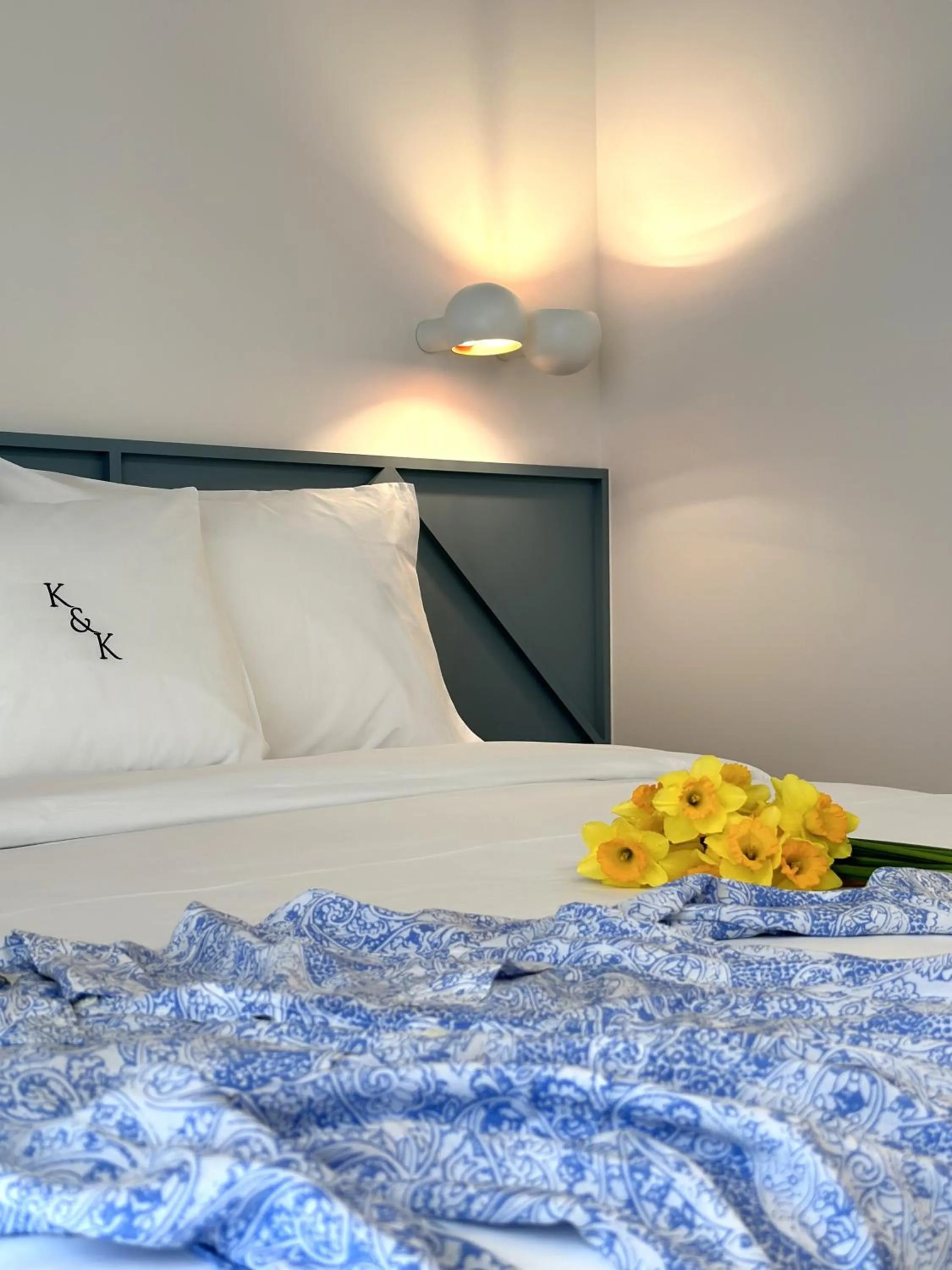 Bed in AIONION RESIDENCES by K&K