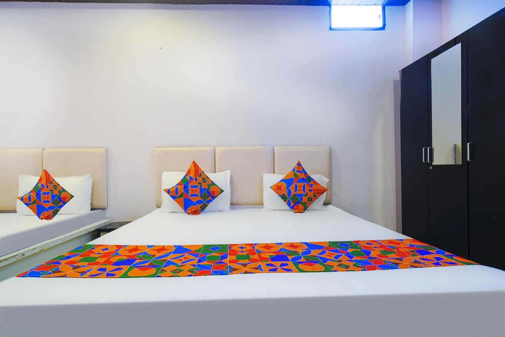 Bed in FabHotel Shree Moti Palace