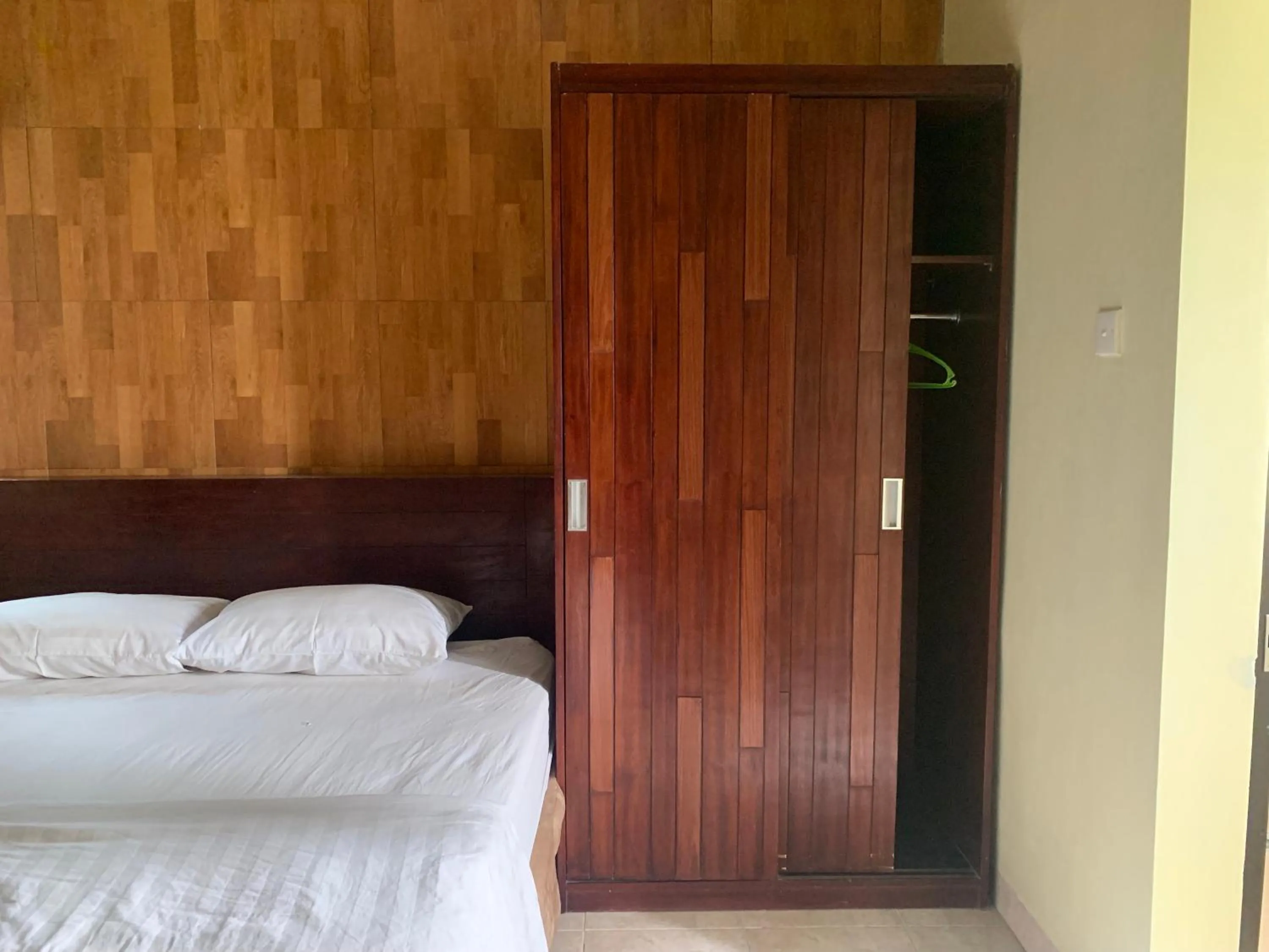 Bed in Cozy Palm Villa