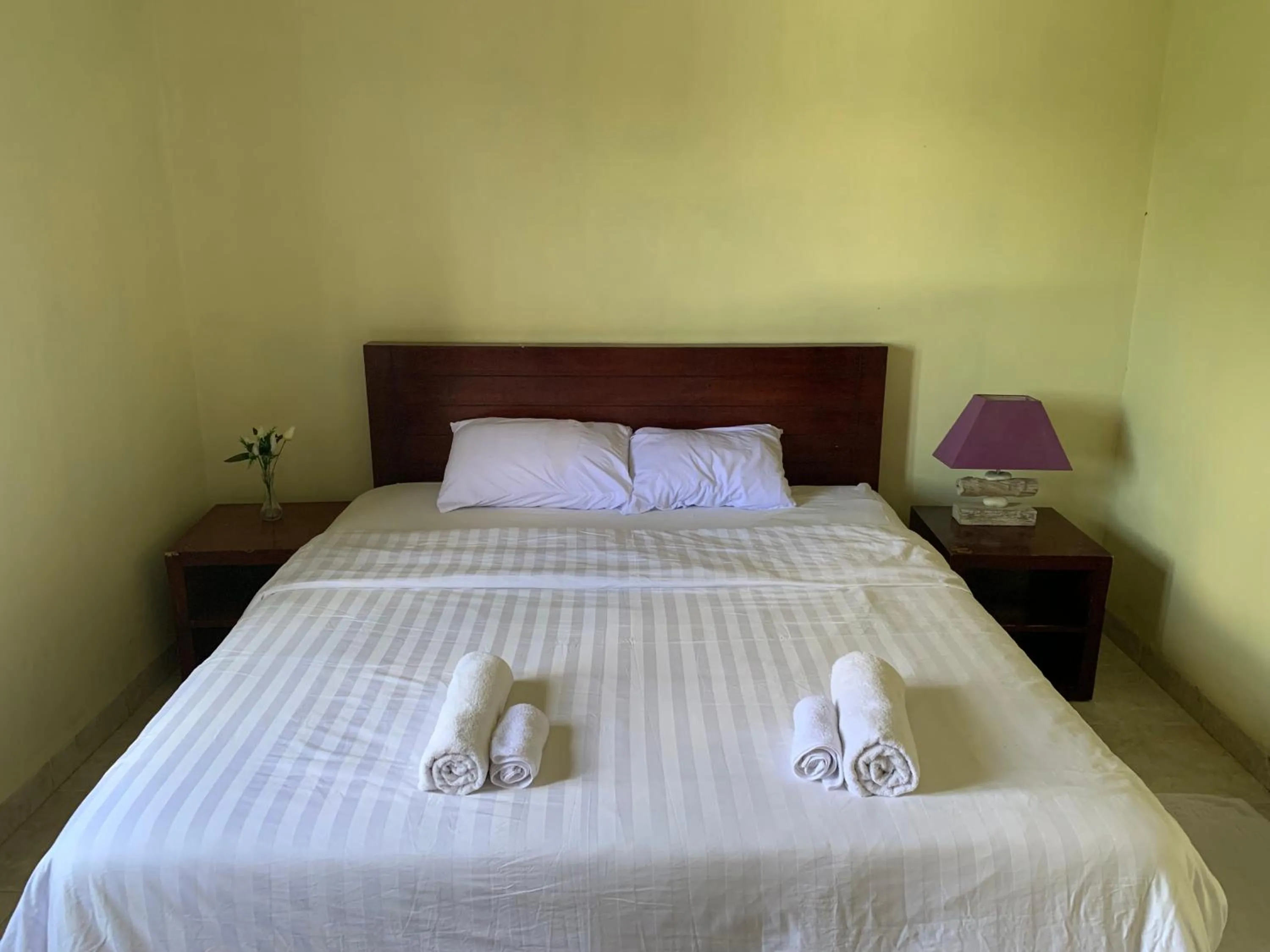 Bed in Cozy Palm Villa