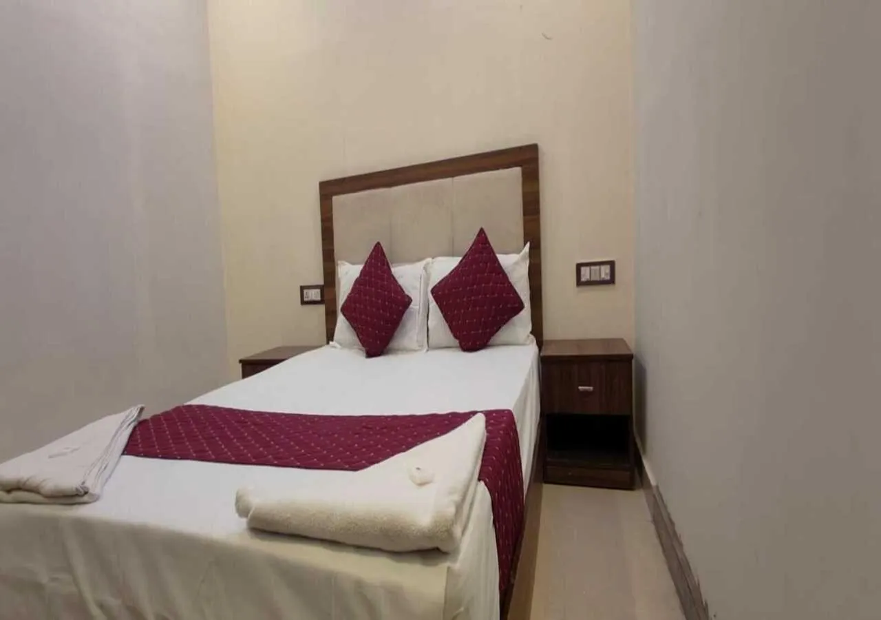 Bed in Hotel Blue Sky Residency