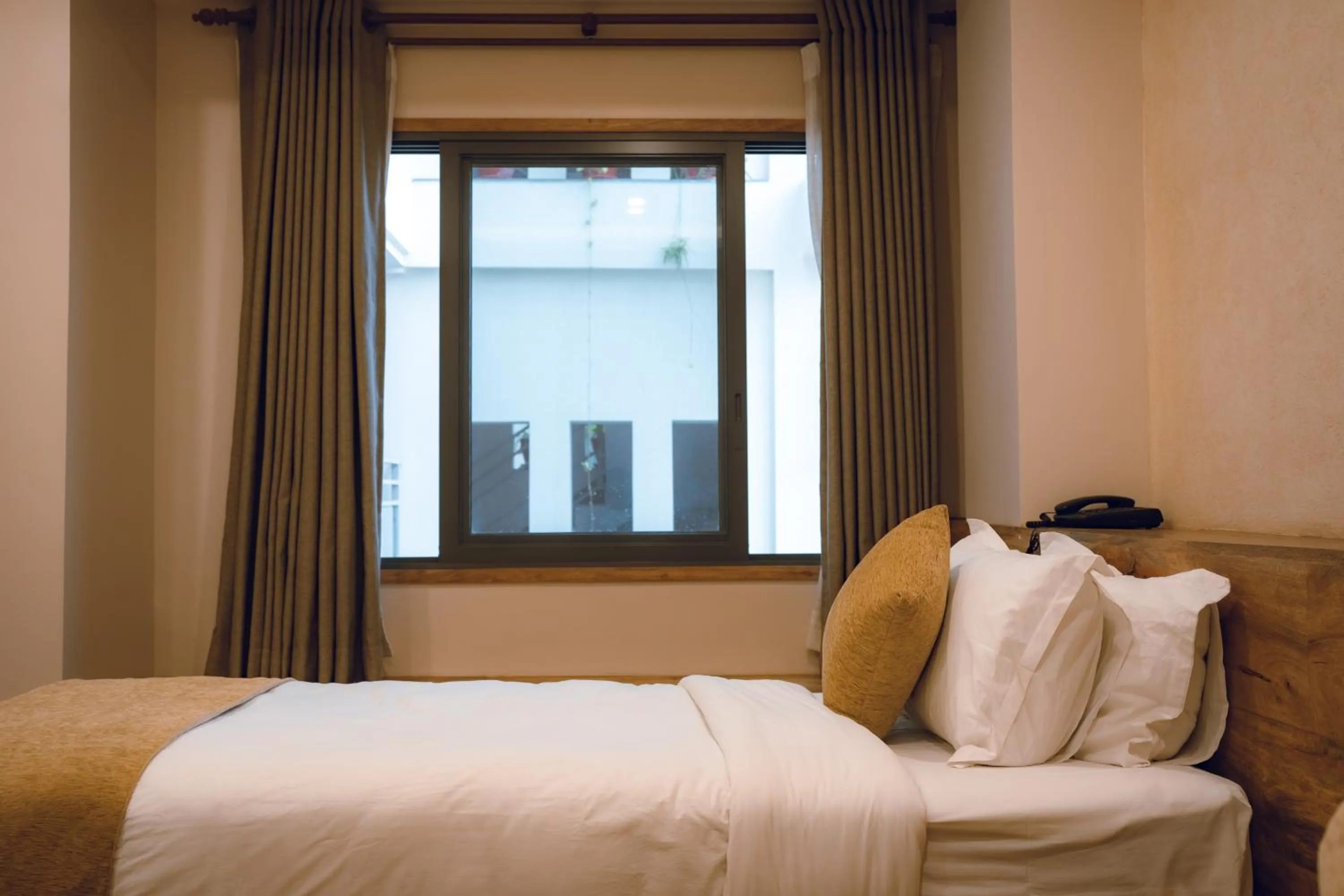 Bed in HOTEL BHRIKUTI TARA