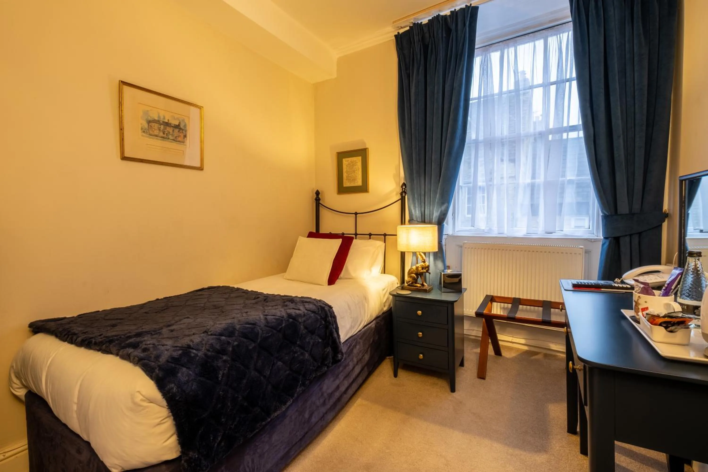 Bed in Corinium Hotel & Restaurant