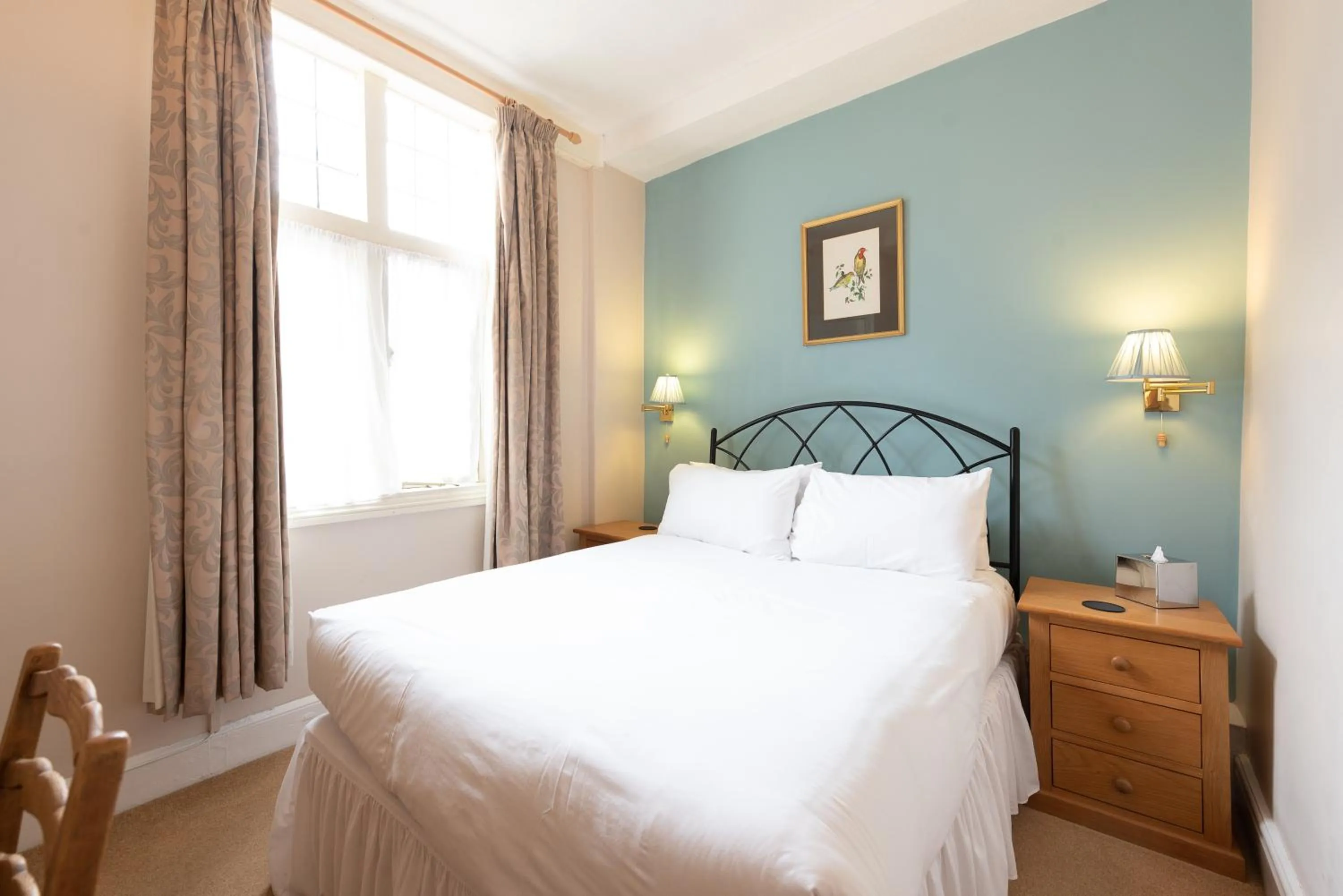 Bed in Corinium Hotel & Restaurant