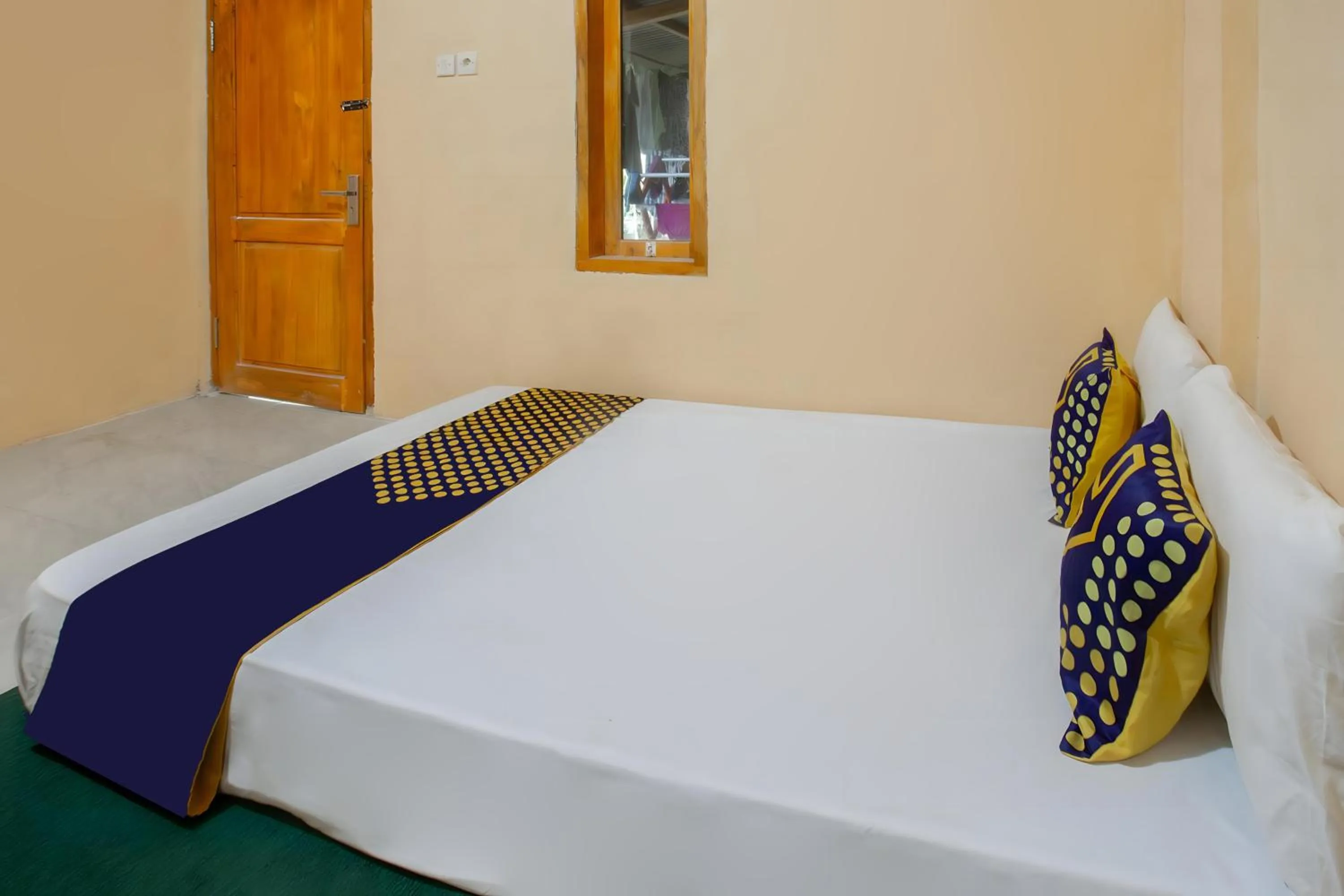 Bedroom, Bed in SPOT ON 93724 Songgong Homestay