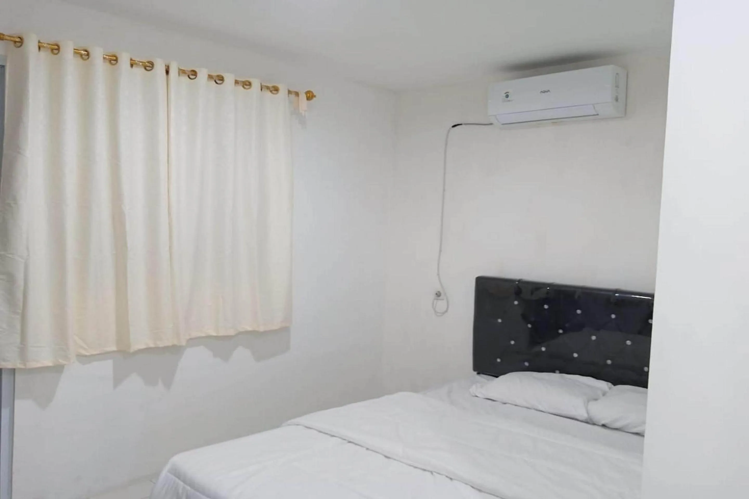 Bedroom in Capital O 93728 Guest House Cemara