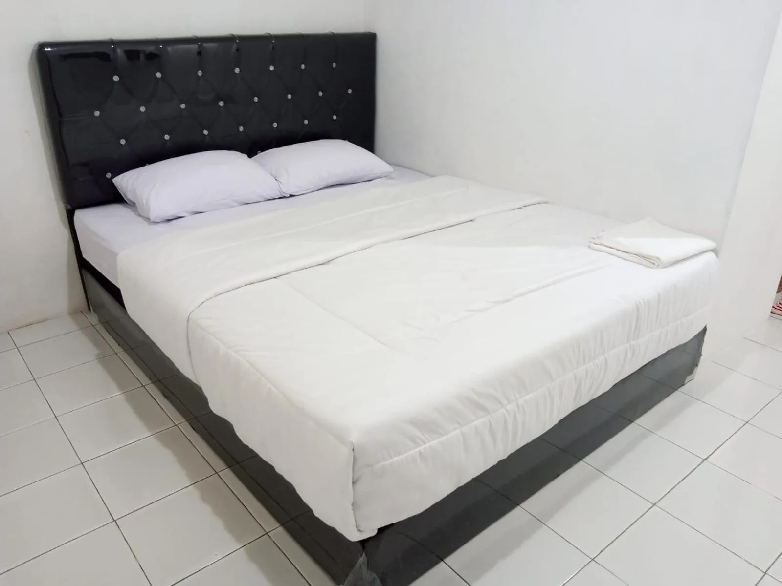 Bedroom in Capital O 93728 Guest House Cemara