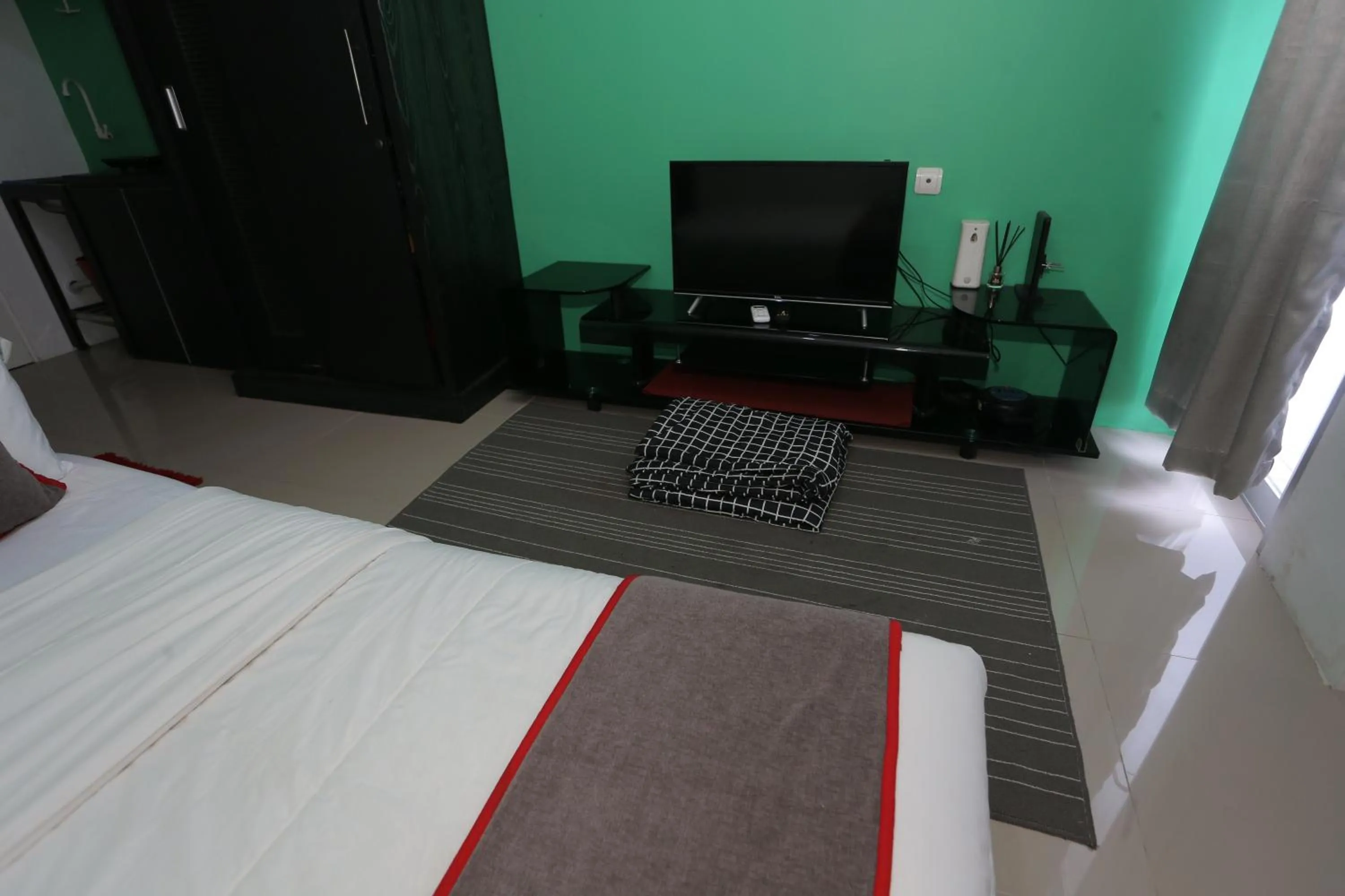 Bedroom in Collection O 93750 Luxury Rooms @ Urbantown Serpong