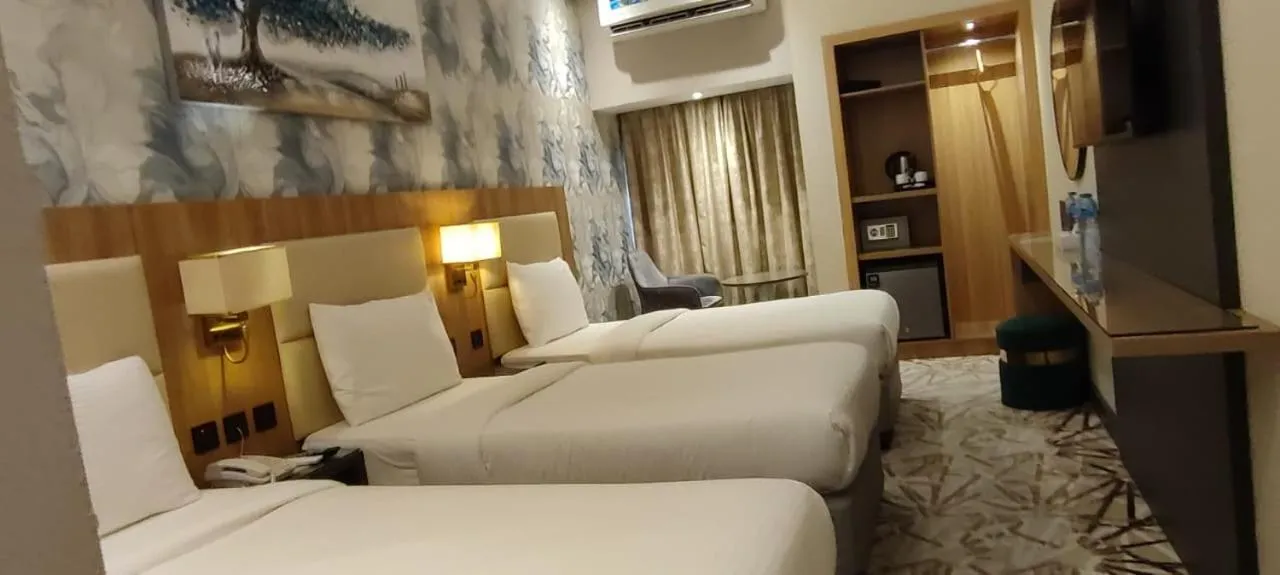 Bed in SKY PARK HOTEL