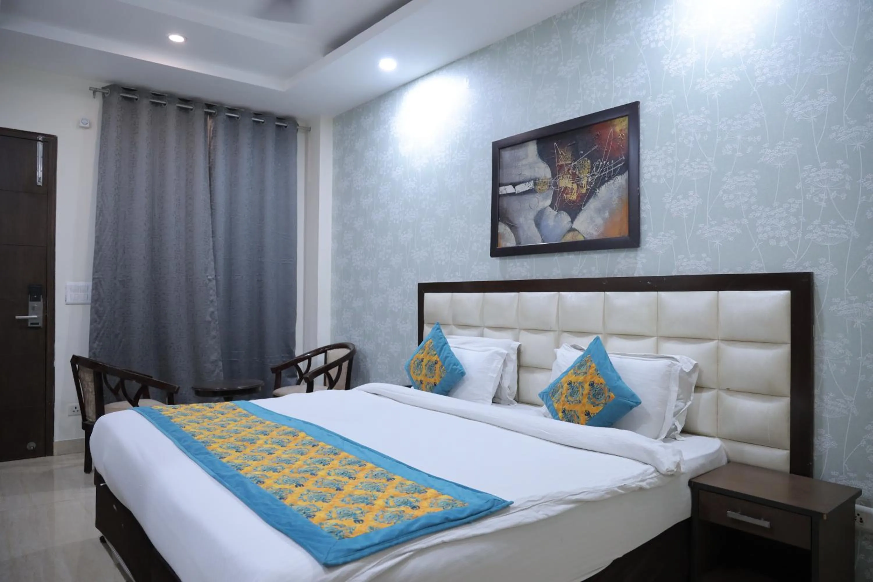 Photo of the whole room, Bed in Hotel Nirvana Suites