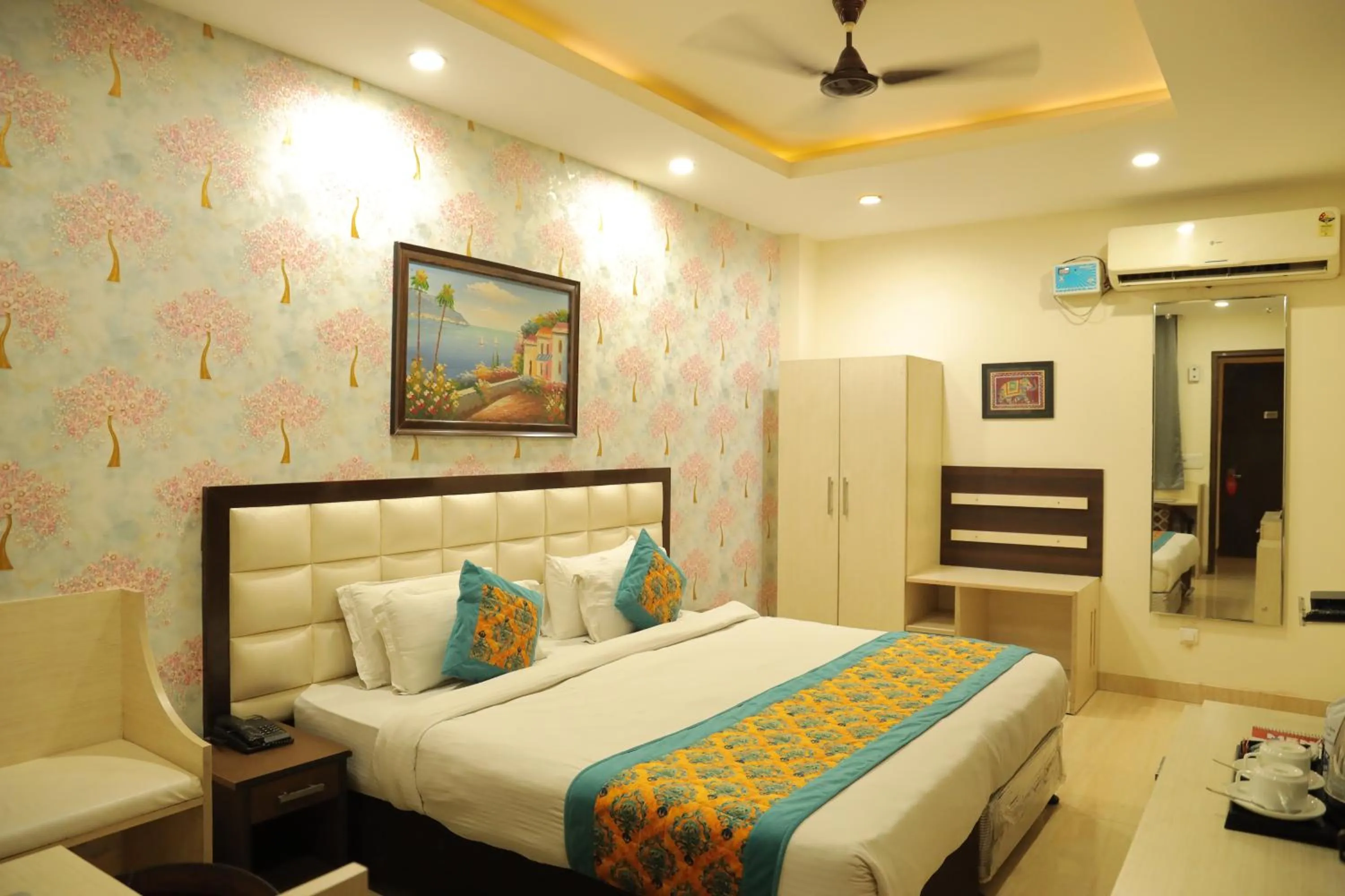 Bed in Hotel Nirvana Suites