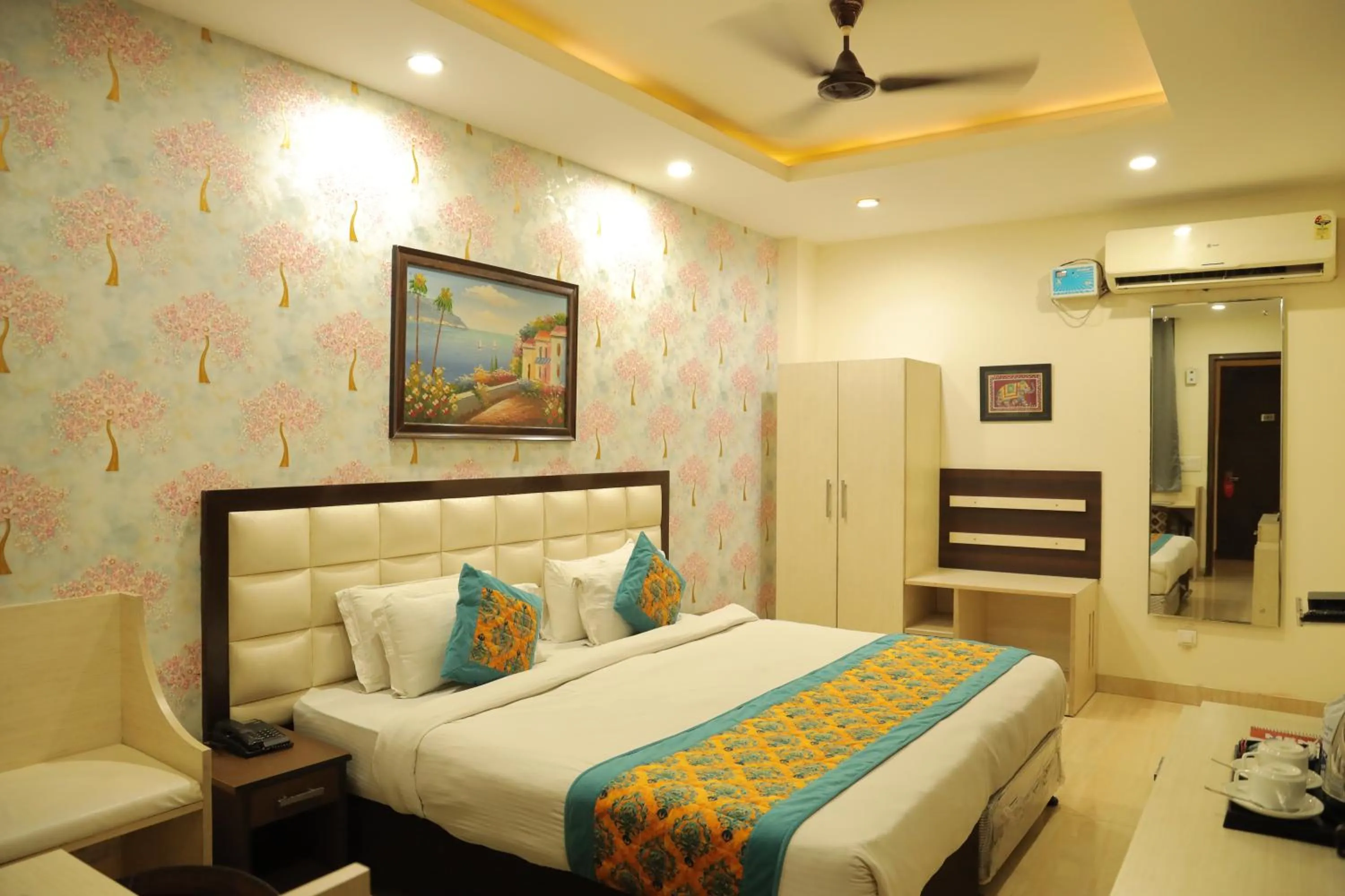 Bed in Hotel Nirvana Suites