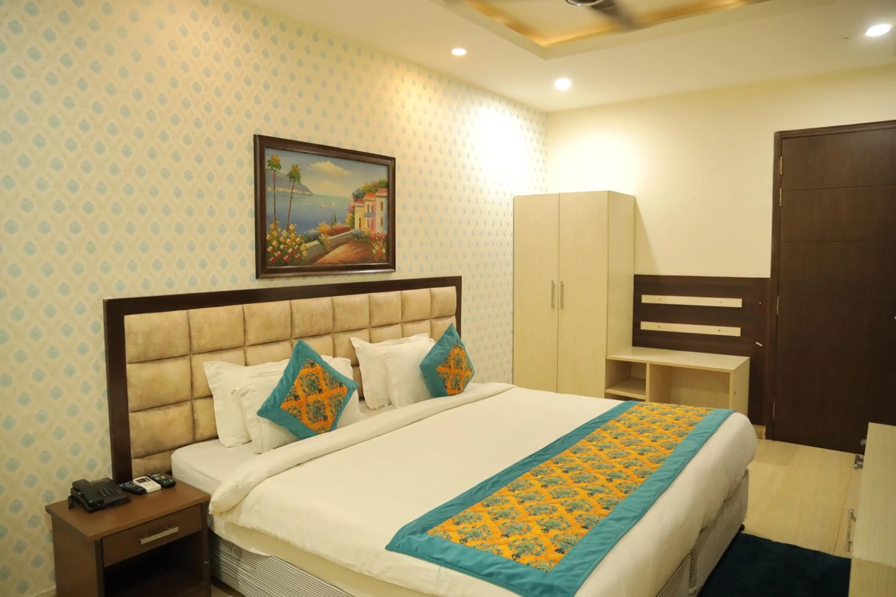 Bed in Hotel Nirvana Suites