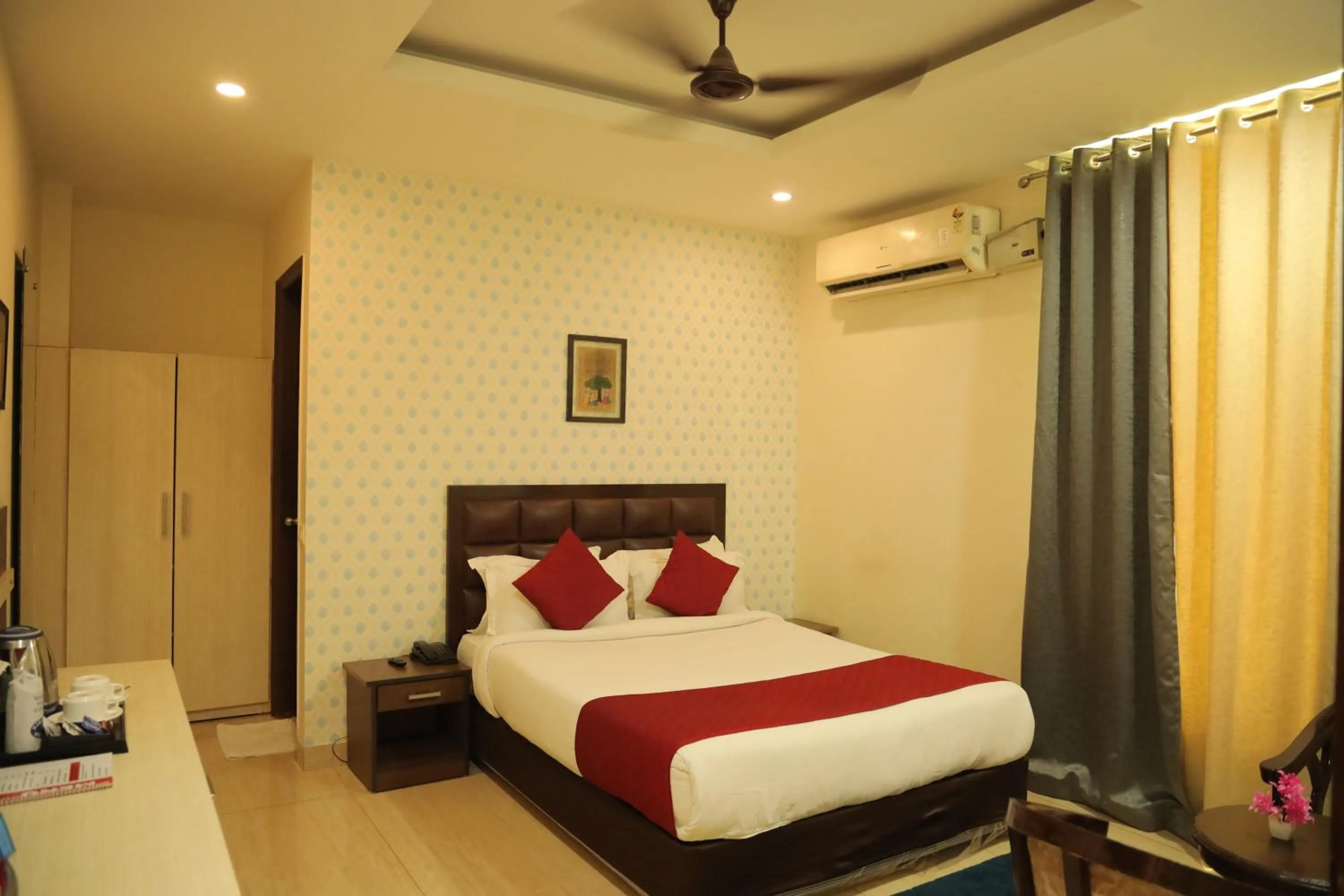 Bed in Hotel Nirvana Suites