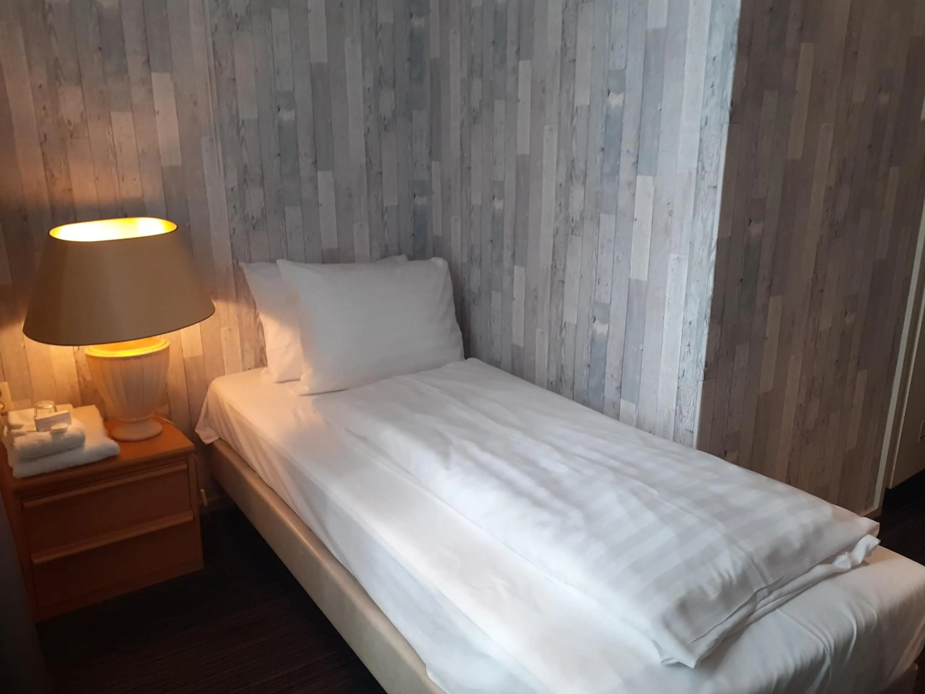 Bed in Grand Hotel Monopole