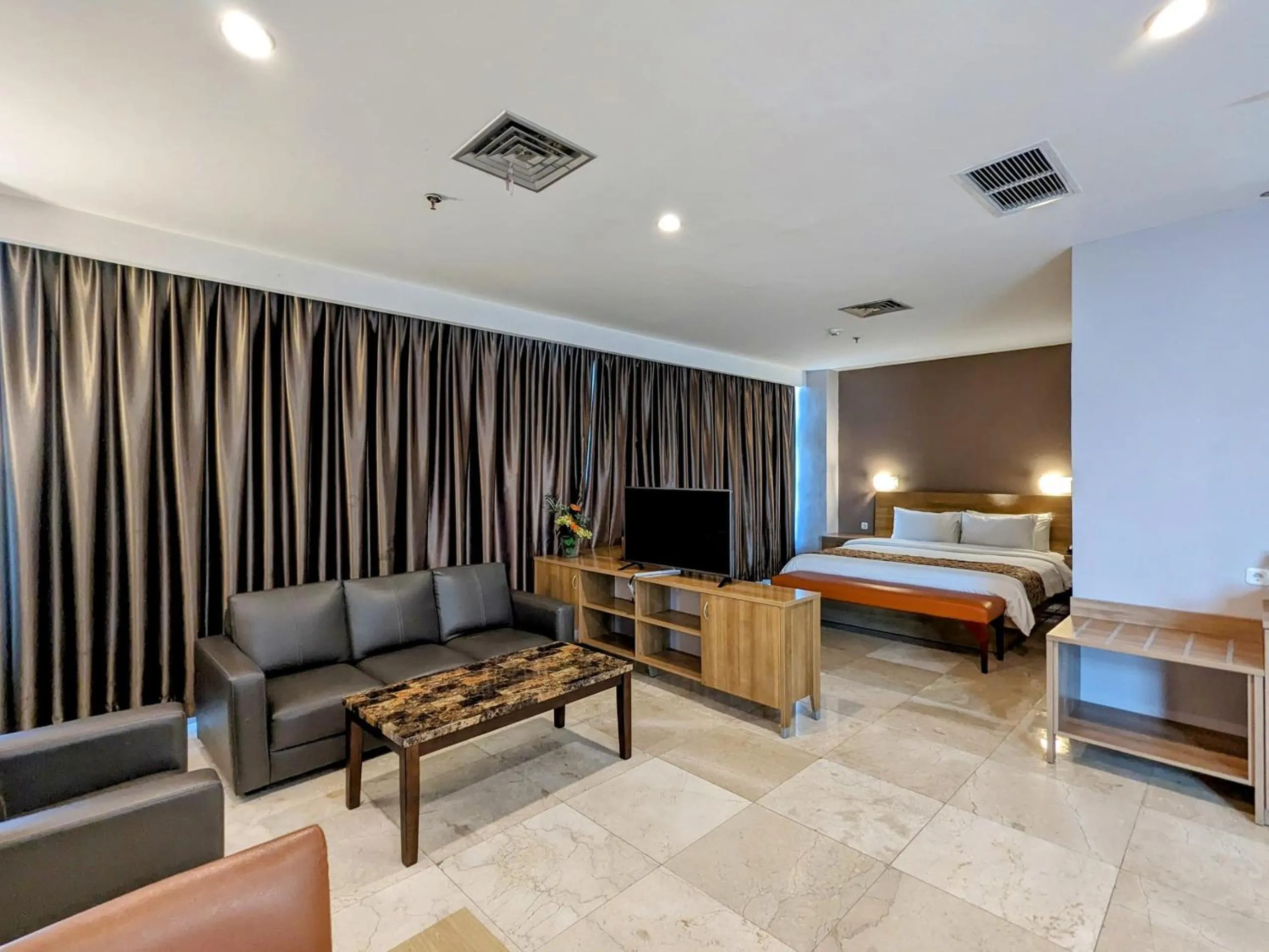 Living room, Bed in Grand Zuri Pematangsiantar