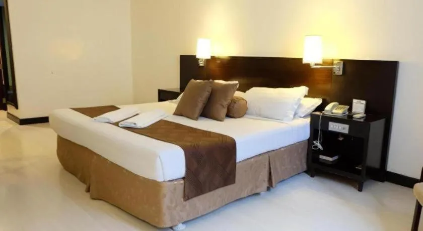 Bed in Hotel Supreme Convention Plaza