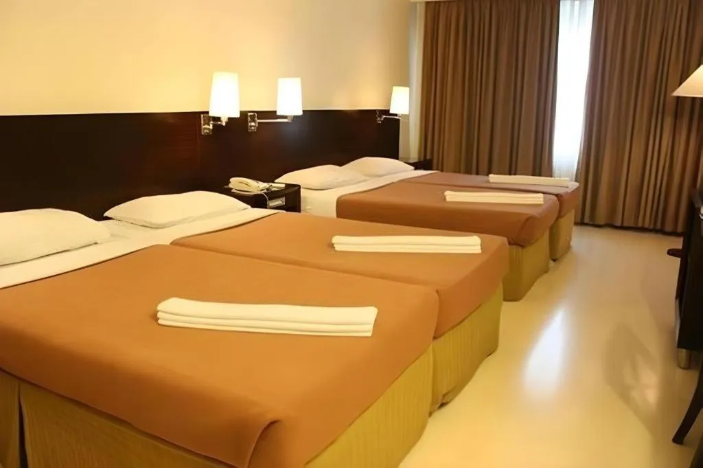 Bed in Hotel Supreme Convention Plaza