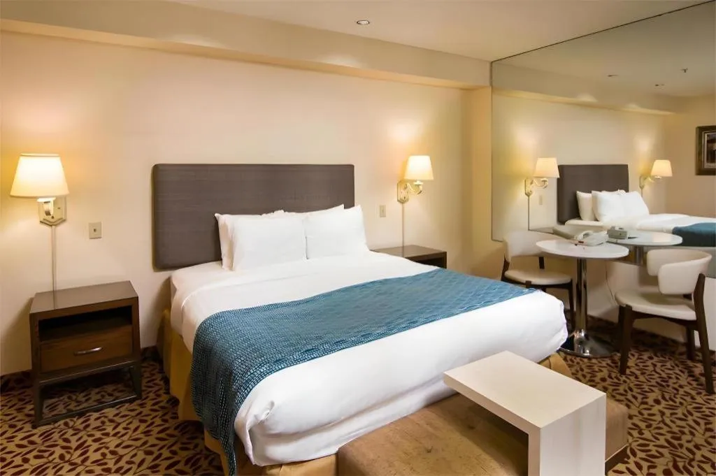 Bed in Laguna Brisas - A Beach Hotel