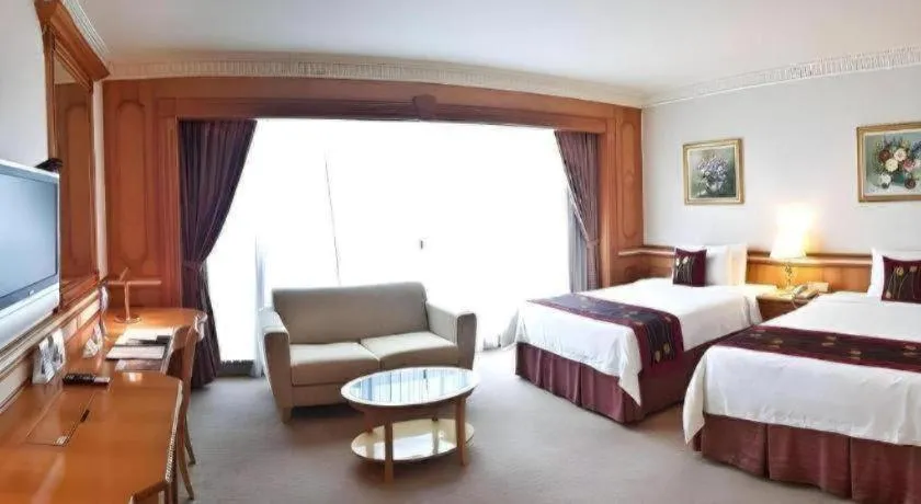 Bed in The Rizqun International Hotel