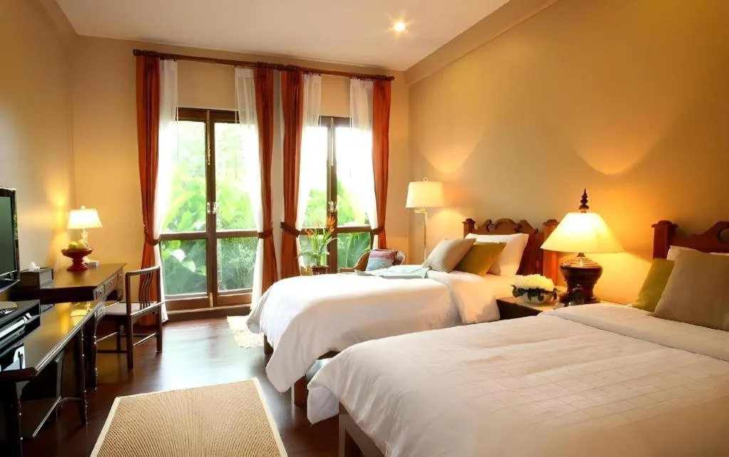 Bed in Baan Klang Wiang Hotel