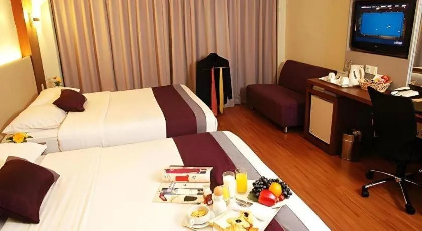 Bed in Grand Cemara Hotel