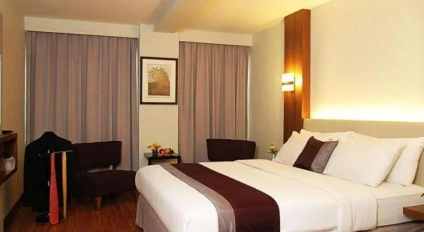 Bed in Grand Cemara Hotel