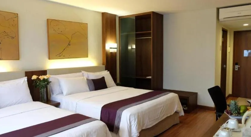 Bed in Grand Cemara Hotel