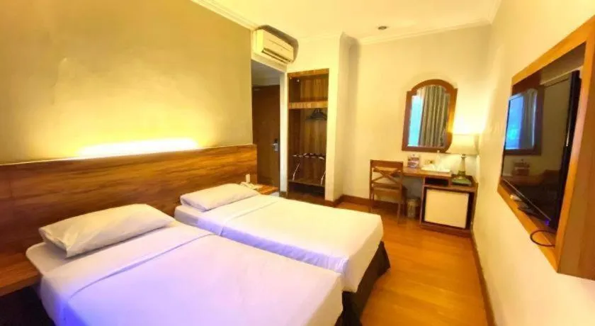 Bed in Grand Cemara Hotel