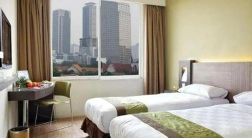 Bed in Grand Cemara Hotel