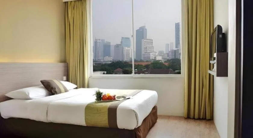 Bed in Grand Cemara Hotel