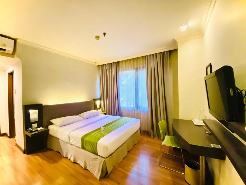 Bed in Grand Cemara Hotel