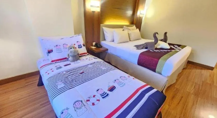 Bed in Grand Cemara Hotel