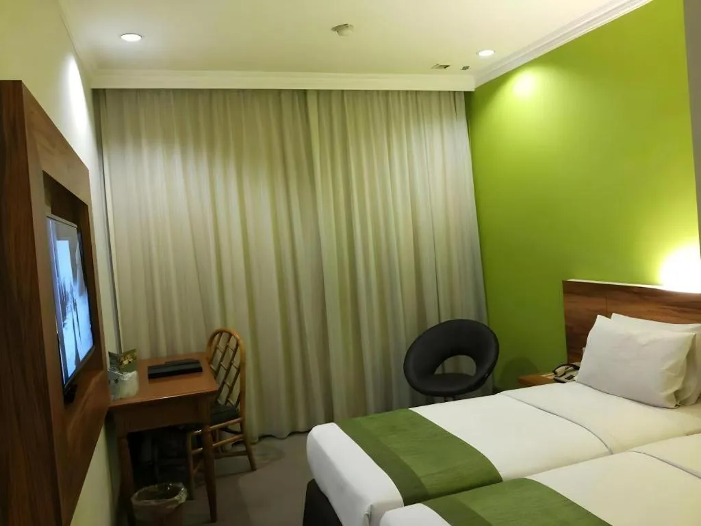 Bed in Grand Cemara Hotel