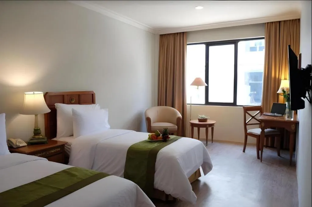 Bed in Grand Cemara Hotel