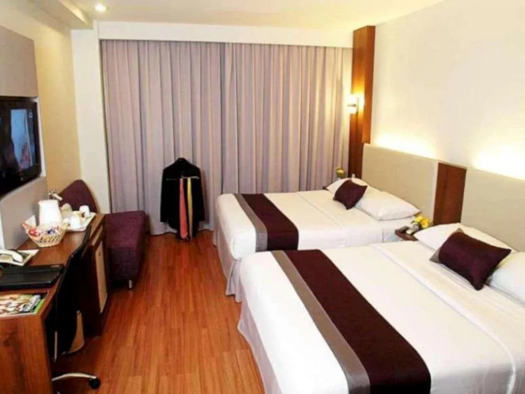 Bed in Grand Cemara Hotel