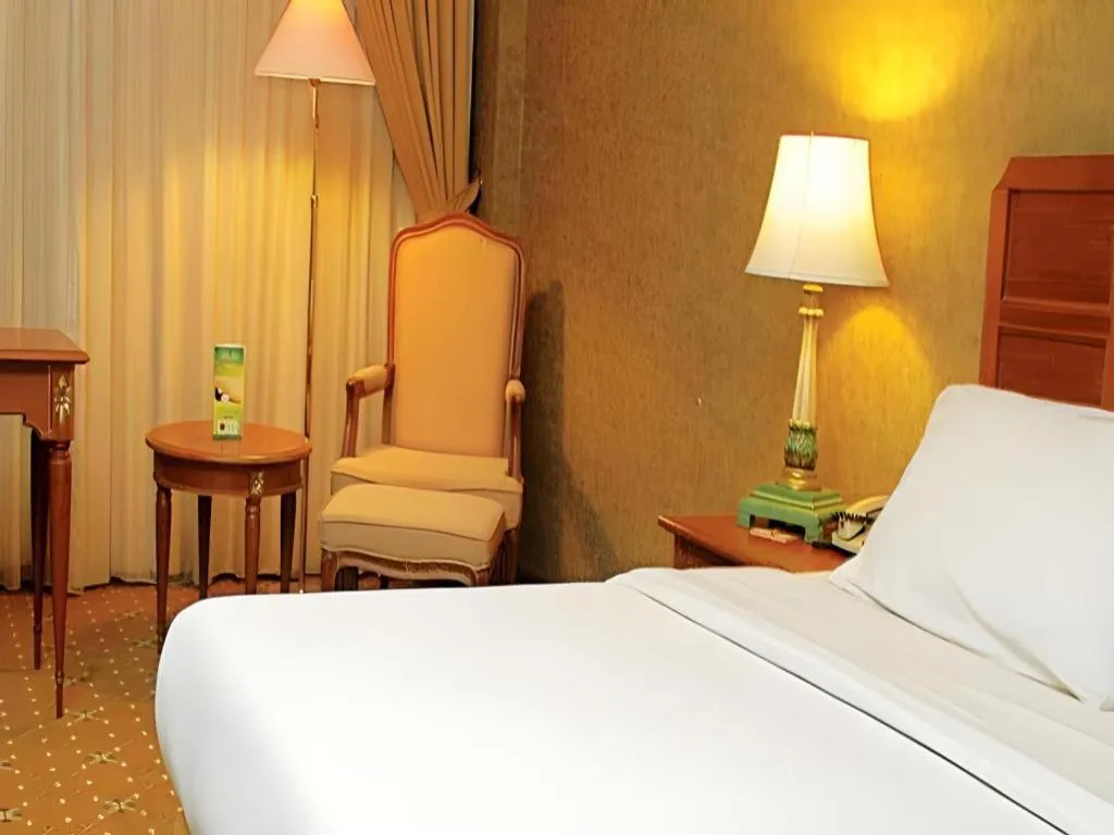 Bed in Grand Cemara Hotel