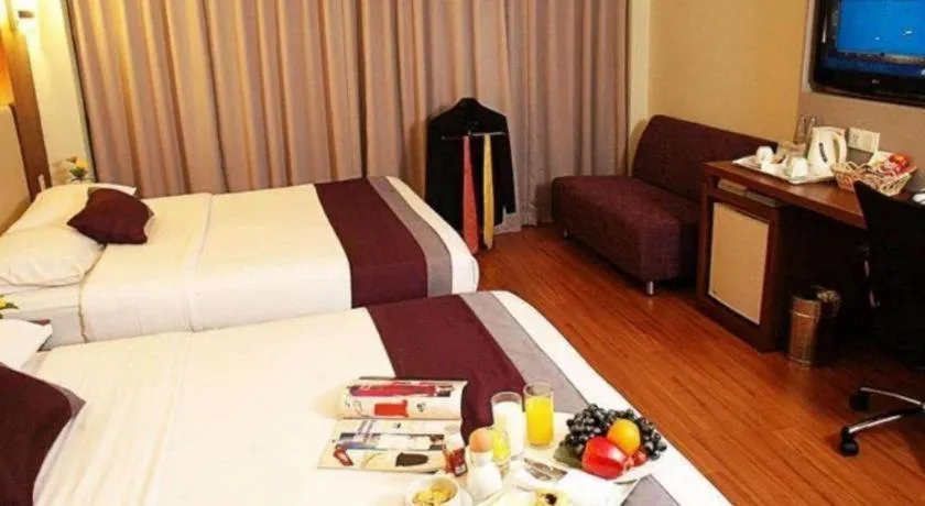 Bed in Grand Cemara Hotel